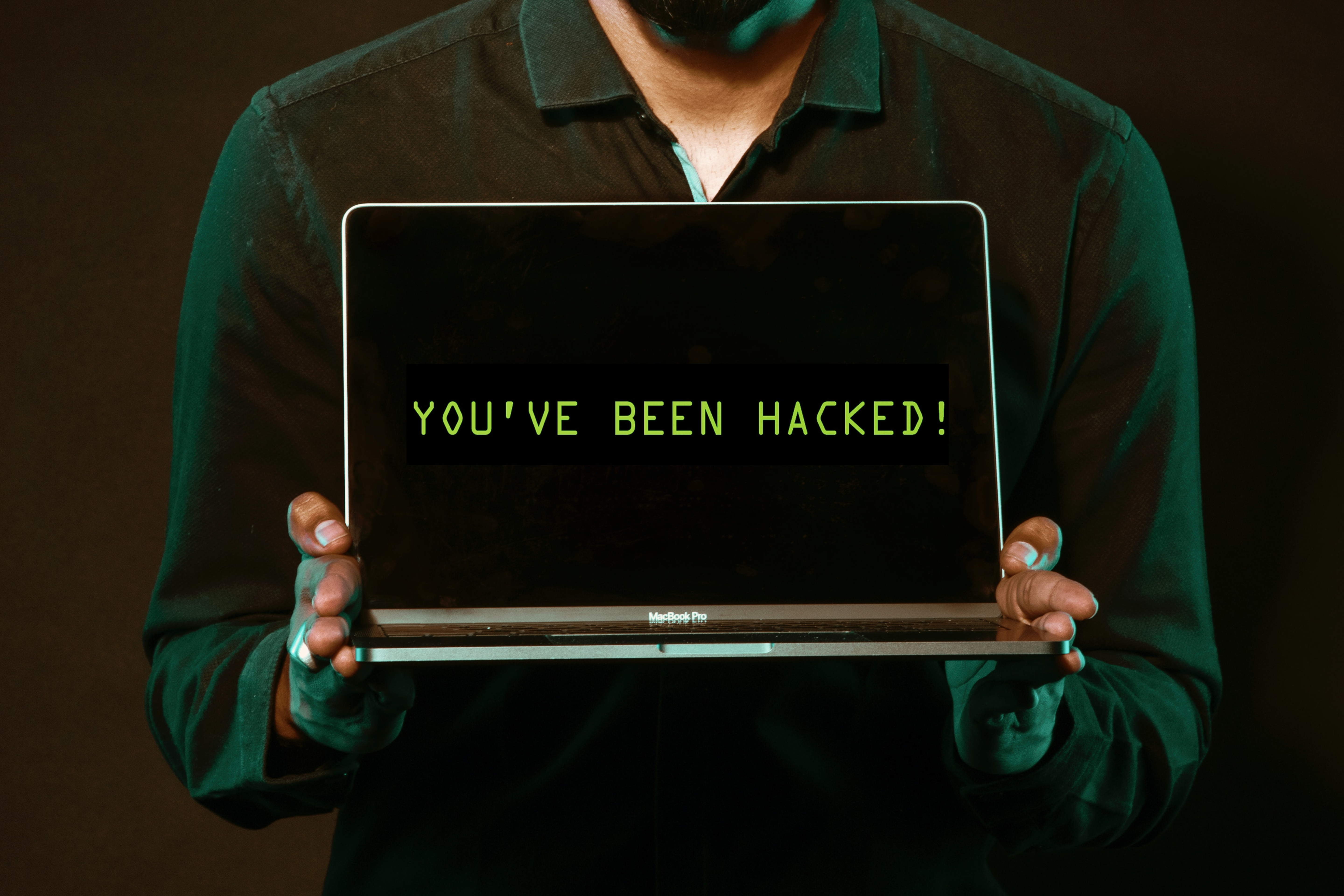 Image of laptop that says you have been hacked, as an anecdotal warning for promotional purposes.